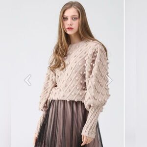 Beautiful Chicwish Pompom sweater in light pink.